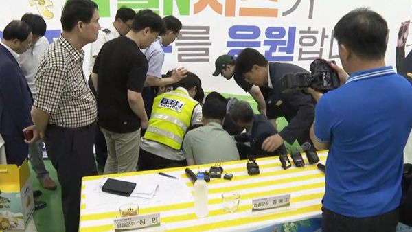 可怕的时刻，病毒式传播的奥运会射击者在新闻发布会上倒下，然后被送往医院